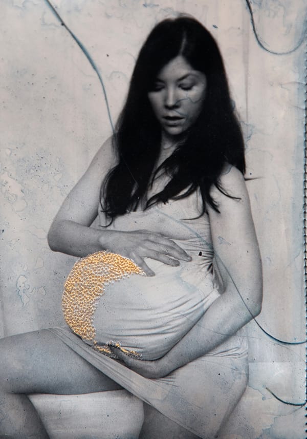 Detail from a work by Jessa Fairbrother showing a woman who appears pregnant holding her belly.